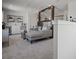 Upstairs living room with wet bar, gray sofa, and separation from bedroom space at 2042 Education St, St Cloud, FL 34771