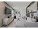Upstairs living room with tv and wet bar, with views to the bedroom space at 2042 Education St, St Cloud, FL 34771