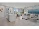Open-concept living space with a kitchen island, dining area, and comfortable seating area at 2042 Education St, St Cloud, FL 34771