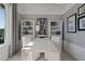 Beautifully decorated home office with custom wallpaper and built-in shelving at 2042 Education St, St Cloud, FL 34771
