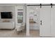 Well-organized pantry with wire shelving and convenient sliding barn door at 2042 Education St, St Cloud, FL 34771