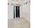 A modern walk-in closet with black hangers and dresses provides convenient clothing storage at 2042 Education St, St Cloud, FL 34771