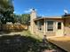 Spacious backyard with a new wooden fence and a beige stucco home at 2078 Keyes Ln, Deltona, FL 32738