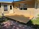 Backyard deck featuring a new wooden deck with a beige stucco home exterior at 2078 Keyes Ln, Deltona, FL 32738
