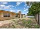 Large backyard with a chimney, windows with shutters, and full fencing at 2078 Keyes Ln, Deltona, FL 32738