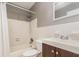 Bathroom includes neutral tile, subway tile in shower with rain shower head, and matching vanity at 2078 Keyes Ln, Deltona, FL 32738