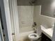 Clean and functional bathroom features a shower with a curtain, a toilet, and a vanity at 2078 Keyes Ln, Deltona, FL 32738