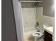 A standard bathroom with a shower-tub combo, toilet, and small vanity at 2078 Keyes Ln, Deltona, FL 32738
