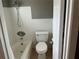 A standard bathroom with a shower-tub combo, toilet and white-tile walls at 2078 Keyes Ln, Deltona, FL 32738