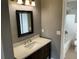 A standard bathroom with vanity, mirror and shower-tub combo at 2078 Keyes Ln, Deltona, FL 32738