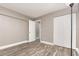 A bedroom showcases plank flooring, taupe colored walls, a large closet and a full length mirror at 2078 Keyes Ln, Deltona, FL 32738