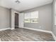 A bedroom featuring plank flooring, neutral colored walls, windows, a closet and white trim at 2078 Keyes Ln, Deltona, FL 32738