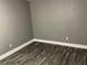 Cozy bedroom with modern gray walls and stylish wood-look flooring, ready for personalization at 2078 Keyes Ln, Deltona, FL 32738