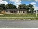 Charming single-story home features a brick facade, neutral stucco, and mature landscaping at 2078 Keyes Ln, Deltona, FL 32738