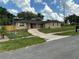 Cozy single-story home with a well-kept lawn and paved driveway at 2078 Keyes Ln, Deltona, FL 32738
