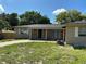 Inviting single-story home with brick accents and a well-manicured front yard at 2078 Keyes Ln, Deltona, FL 32738