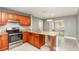 Well-lit kitchen with stainless steel appliances and granite countertops at 2078 Keyes Ln, Deltona, FL 32738