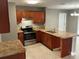 Kitchen with stainless steel appliances, granite countertops, and ample cabinet space at 2078 Keyes Ln, Deltona, FL 32738