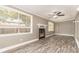 Spacious living room with large windows and a modern fireplace at 2078 Keyes Ln, Deltona, FL 32738