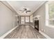 Inviting living room with a cozy fireplace and ample natural light at 2078 Keyes Ln, Deltona, FL 32738