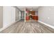 Open-concept living space with hardwood floors, flowing to the kitchen at 2078 Keyes Ln, Deltona, FL 32738