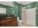 A bathroom with a vanity sink, decorative mirror, and shower with a curtain at 2216 Sequoia Way, Davenport, FL 33896