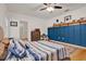 Comfortable bedroom with wood floors, stylish accent wall, and plenty of natural light at 2216 Sequoia Way, Davenport, FL 33896