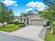 Charming one-story home boasting a two-car garage and meticulously maintained landscaping at 2216 Sequoia Way, Davenport, FL 33896