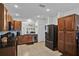 Modern kitchen with stainless steel appliances, granite countertops, and ample cabinet space at 2216 Sequoia Way, Davenport, FL 33896