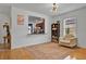 Cozy living area with hardwood floors, a decorative rug, and natural light from the window at 2216 Sequoia Way, Davenport, FL 33896