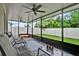 Spacious screened-in patio with brick flooring, ceiling fans, and outdoor seating at 2216 Sequoia Way, Davenport, FL 33896
