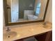 Bathroom featuring double sinks, granite countertop, soaking tub, and glass shower at 2299 Rock Dr, Poinciana, FL 34759