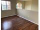 Bedroom with laminated floors, neutral colored walls, and natural light at 2299 Rock Dr, Poinciana, FL 34759