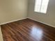 Bedroom with laminated floors, neutral colored walls, and natural light at 2299 Rock Dr, Poinciana, FL 34759
