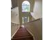 Staircase leading to a front door, with a large window providing natural light at 2299 Rock Dr, Poinciana, FL 34759