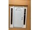 Close-up of a white front door, with sidelights and a half-round window at 2299 Rock Dr, Poinciana, FL 34759