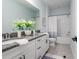 Bright bathroom with granite countertops, double sinks, and a shower/tub combo, offering a blend of style and functionality at 2354 Emerald Springs Dr, Apopka, FL 32712