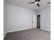Clean and simple bedroom featuring a ceiling fan, closet, neutral paint, and plush carpeting for a cozy atmosphere at 2354 Emerald Springs Dr, Apopka, FL 32712