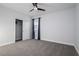 Cozy bedroom featuring a ceiling fan, closet, neutral paint, and plush carpeting, creating a comfortable and inviting space at 2354 Emerald Springs Dr, Apopka, FL 32712