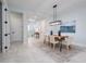 Open-concept dining area with modern lighting and design, perfect for entertaining and everyday living at 2354 Emerald Springs Dr, Apopka, FL 32712