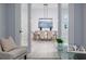 Open-concept dining room showcasing modern light fixture and neutral color palette from living room view at 2354 Emerald Springs Dr, Apopka, FL 32712