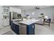 Spacious kitchen with large island and stainless appliances open to the living area at 2354 Emerald Springs Dr, Apopka, FL 32712