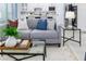 Stylish living room with kitchen view, featuring modern decor and comfortable seating at 2354 Emerald Springs Dr, Apopka, FL 32712