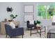 Bright living room with ample seating, neutral décor, and modern wall art for a contemporary touch at 2354 Emerald Springs Dr, Apopka, FL 32712