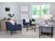 Inviting living room featuring modern decor, comfortable seating, and ample natural light, creating a cozy ambiance at 2354 Emerald Springs Dr, Apopka, FL 32712