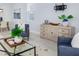 Cozy living room features neutral tones and modern furniture, with dining area visible for an open layout at 2354 Emerald Springs Dr, Apopka, FL 32712