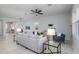 Bright living room with tile flooring, ceiling fan, contemporary furnishings, and neutral decor at 2354 Emerald Springs Dr, Apopka, FL 32712