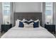 Cozy main bedroom with a stylish headboard, matching lamps, and coordinated decor, a peaceful retreat at 2354 Emerald Springs Dr, Apopka, FL 32712