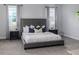 Elegant main bedroom with a large bed, side tables, and ample space at 2354 Emerald Springs Dr, Apopka, FL 32712