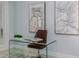 Bright office with clear desk, brown chair, and artwork, providing an inviting workspace at 2354 Emerald Springs Dr, Apopka, FL 32712